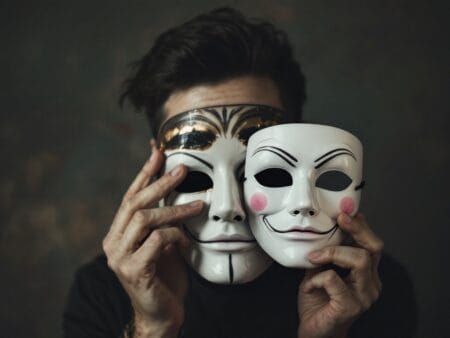 A person discarding a Venice styled mask, symbolizing removing false identity and escaping identity trap